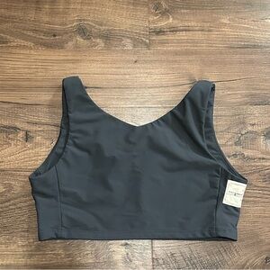 For Them chest binder in the shade Charcoal and the size Fire.